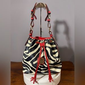 Dooney and Bourke zebra bucket bag with red leather trim